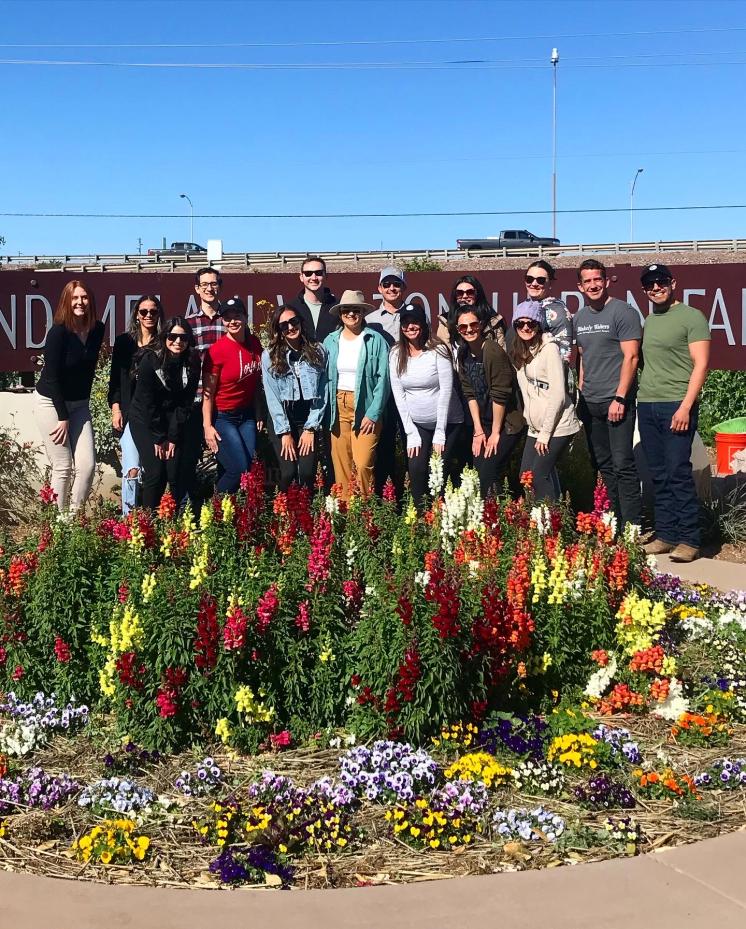rising-leaders-image-2 group of people posing outside the urban farm